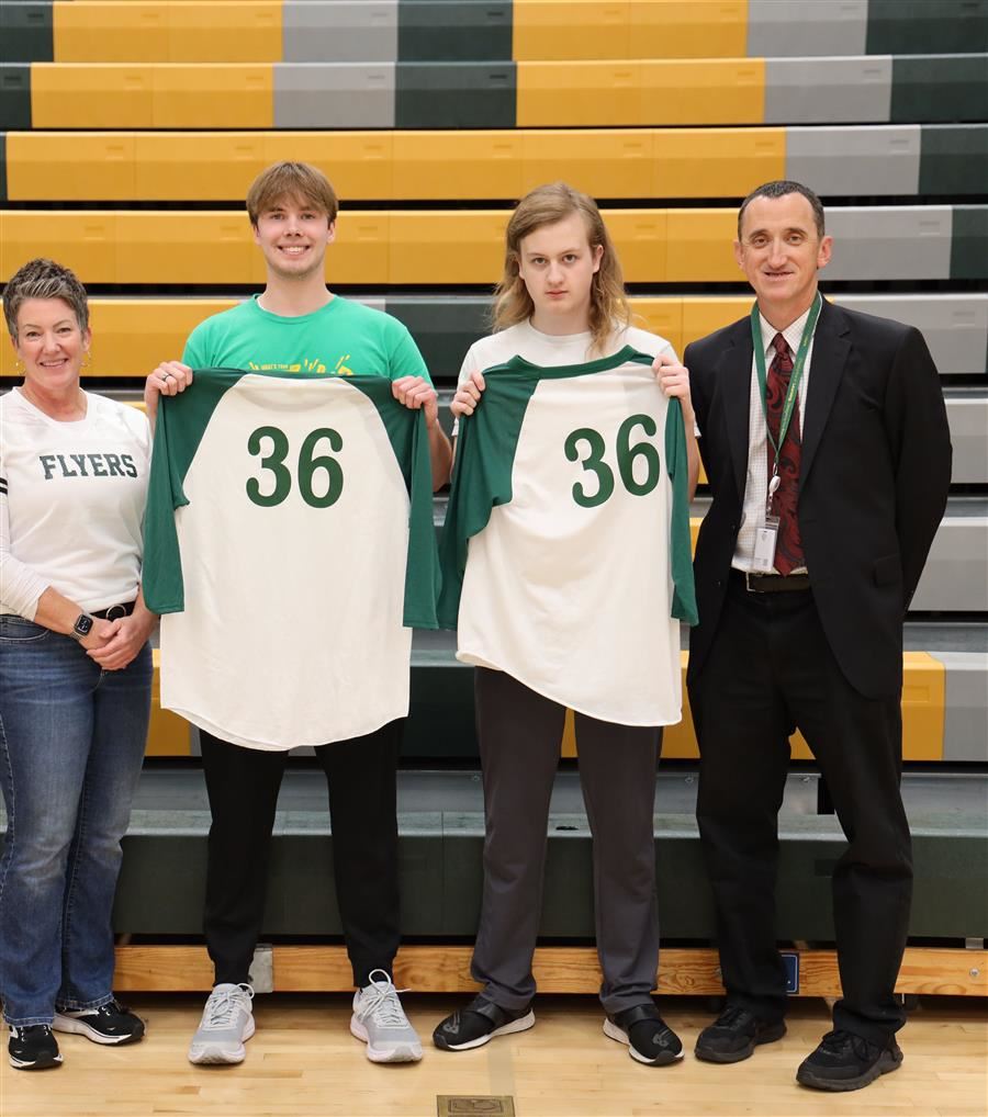  Mason Vander Meer and Henry Ourth hold shirts with the numbe 36 on them